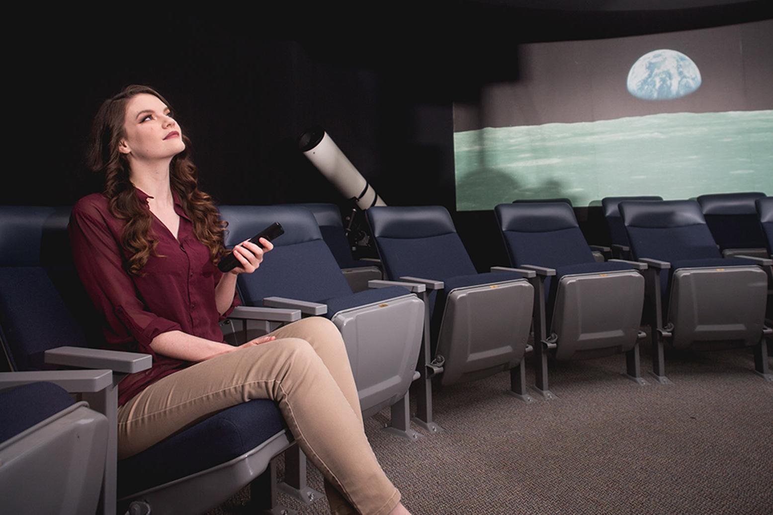 Deborah Gulledge poses for photo in observatory